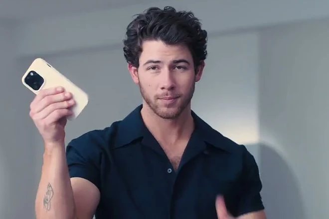 Nick Jonas holding the Dexcom G7 as part of Super Bowl spot